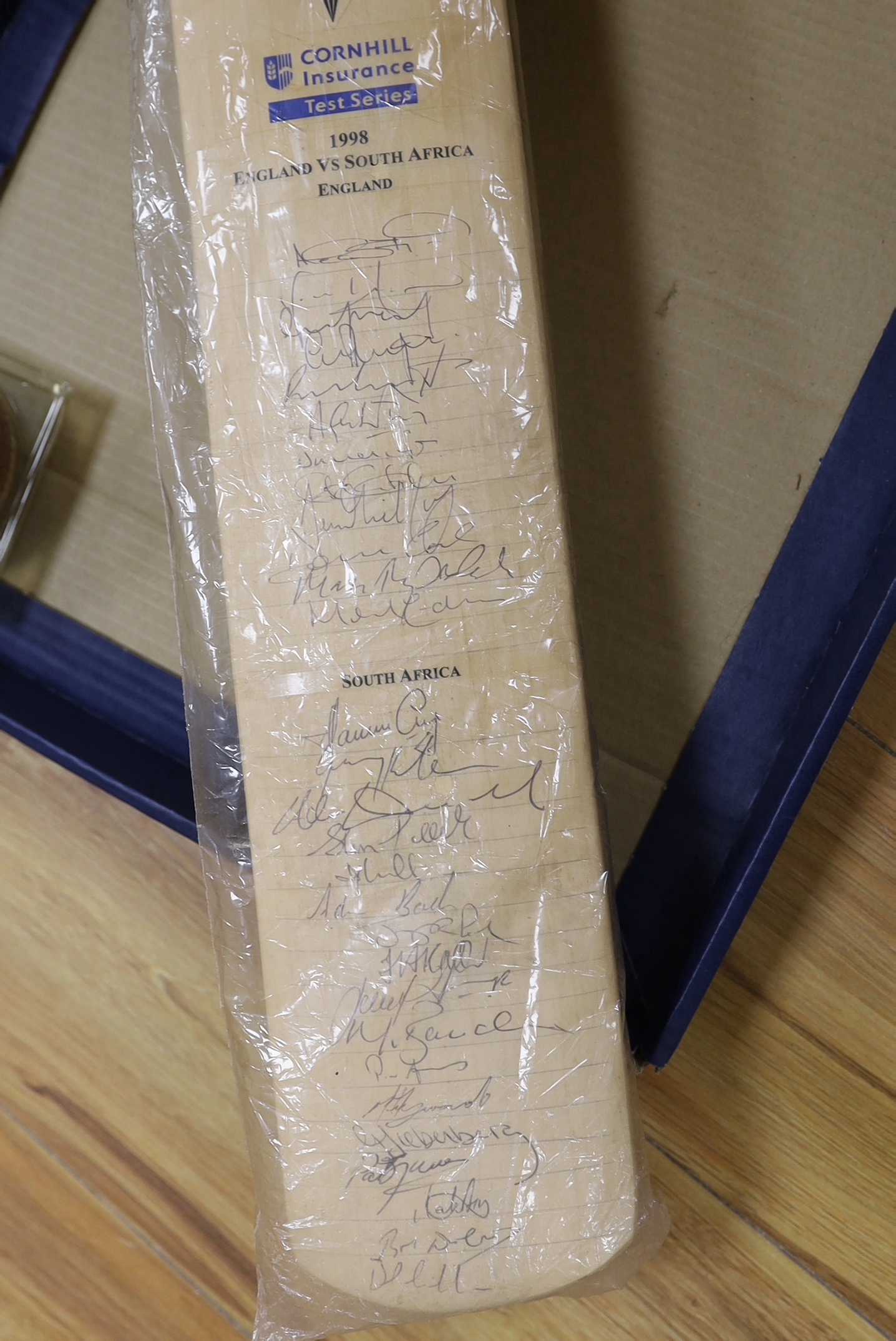 An autographed England rugby shirt, a similar England -v- South Africa 1998 Test Series cricket bat and a cricket ball